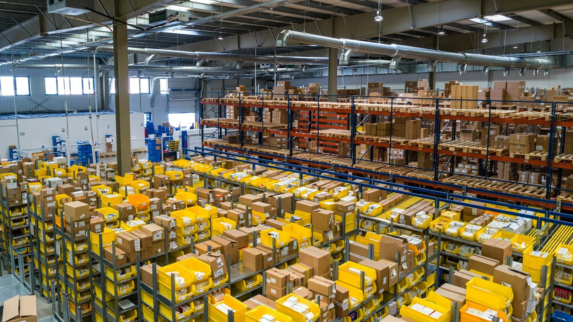 A warehouse full of shelves of boxes ready to ship